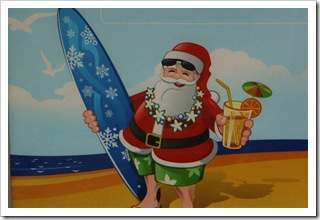 Święty Mikołaj na wakacjach - plakat w sklepie